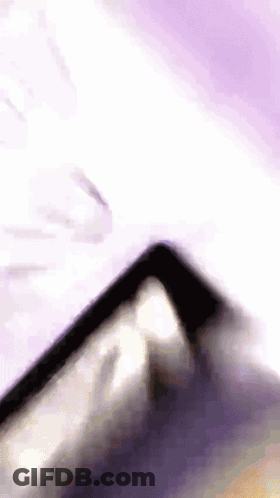 Cell Phone On Purple Background GIF