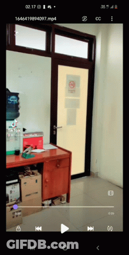 Cell Phone Showing Room With No Smoking Sign GIF