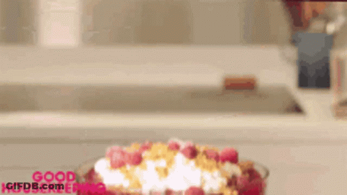 Cereal Bowl With Raspberries And Whipped Cream Good Housekeeping GIF