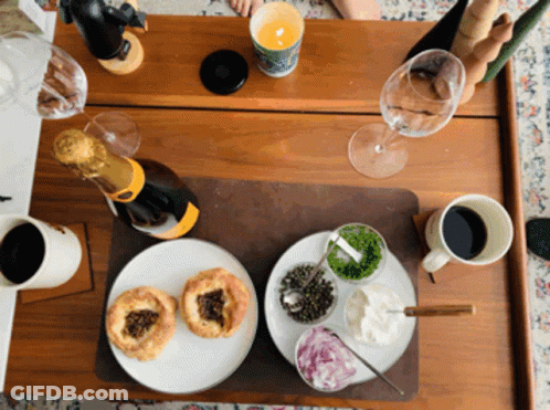 Champagne Bottle On Wooden Table GIF