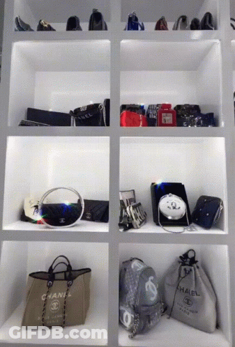 Chanel Bag On Shelf Next To Other Bags GIF