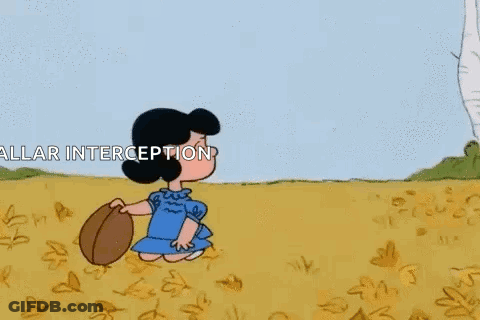 Charlie Brown And Lucy Brown Are Playing In A Field And Charlie Brown Is Holding Lucy Brown In The Air . GIF
