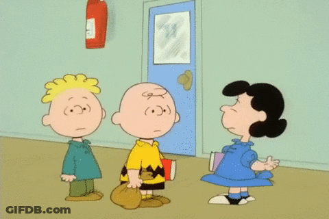 Charlie Brown And Lucy Brown Are Standing Next To Each Other In A Hallway GIF