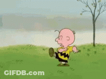 Charlie Brown From The Peanuts Cartoon Is Running In A Field . GIF
