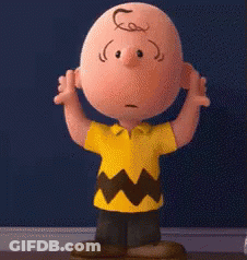 Charlie Brown From The Peanuts Movie Is Standing In Front Of A Blue Wall With His Hands Outstretched . GIF