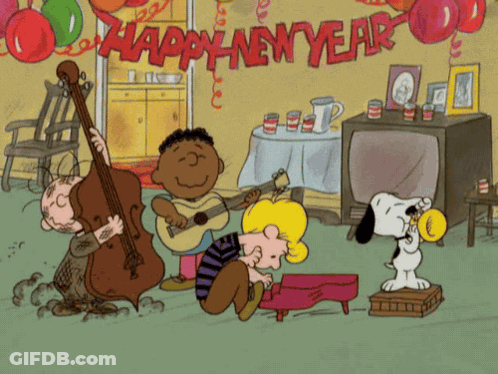 Charlie Brown Holding Paper And Smiling GIF