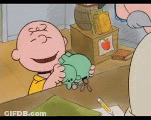 Charlie Brown Holding Stuffed Animal Number 3 GIF