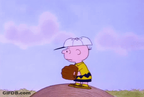 Charlie Brown Is Doing A Handstand In The Air While Wearing Socks And Shoes . GIF