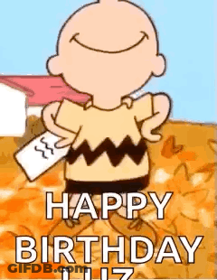 Charlie Brown Is Holding A Piece Of Paper In His Hand And Smiling . GIF