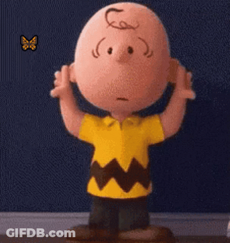 Charlie Brown Standing In Front Of Blue Wall With Butterfly GIF