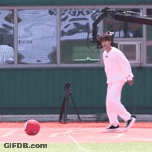 Charlie Brown Walking On Grassy Field GIF