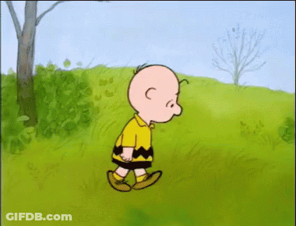 Charlie Brown Walking On Grassy Field GIF