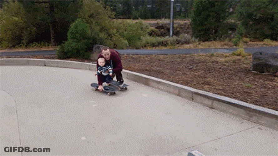 Charming Father Son Skateboard Bonding GIF