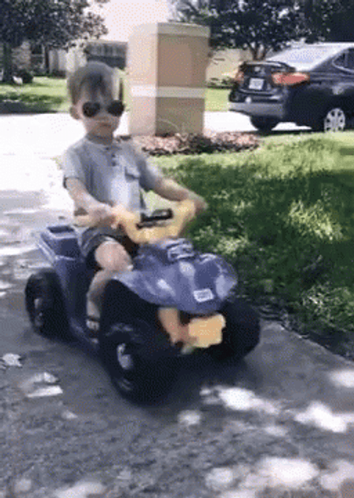 Charming Kid Riding Toy Car They See Me Rollin GIF