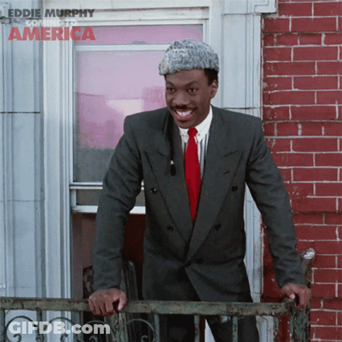 Cheerful Eddie Murphy On The Balcony GIF