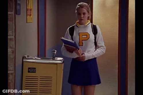 Cheerleader Girl Holding Notebook By Fountain GIF