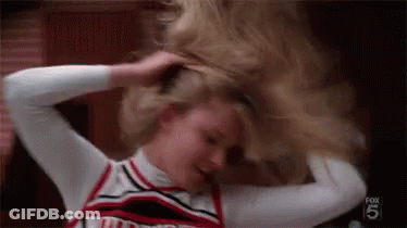 Cheerleader Holding Ponytail GIF