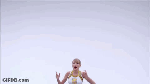 Cheerleader In Crop Top And Blue Skirt Jumping GIF