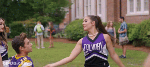 Cheerleader In Purple Salvary Uniform Dancing With Boy GIF