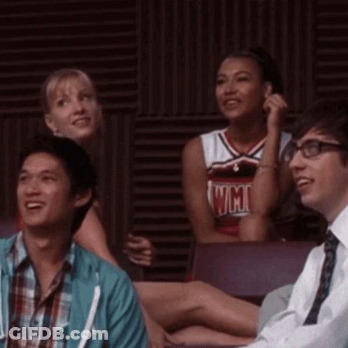 Cheerleader In UCSD Jersey Beside Man GIF