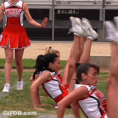 Cheerleader In VMHS Uniform Next To Group GIF