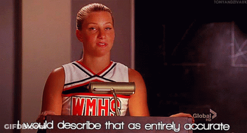 Cheerleader In WMHS Uniform At Podium GIF