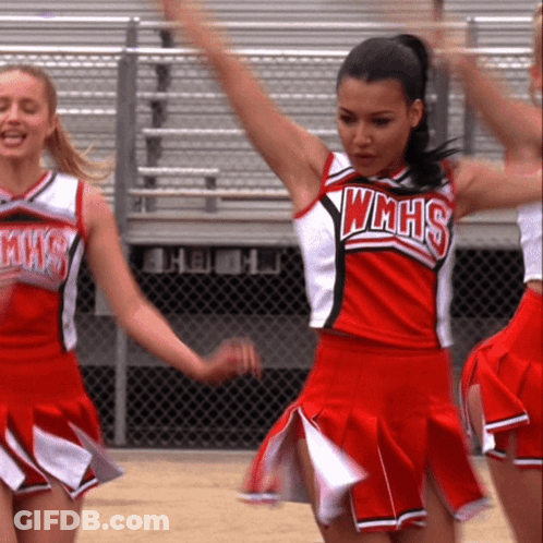 Cheerleader In WMHS Uniform Holding Arms Up GIF