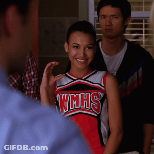 Cheerleader In WMHS Uniform Smiling Man Watching GIF