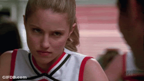 Cheerleader Looking At Man In Gym GIF