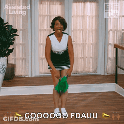 Cheerleader Saying Gooooo With Green Pom Pom GIF