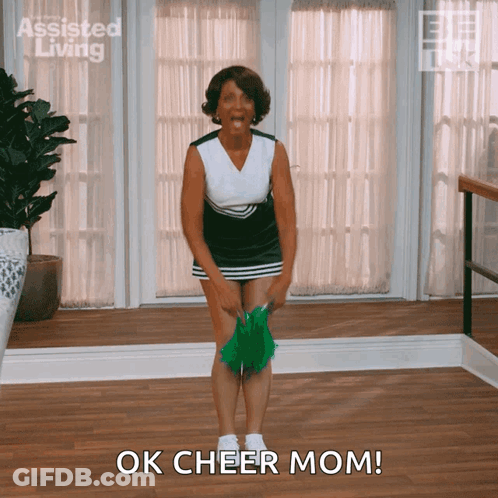 Cheerleader Saying Ok Cheer Mom With Green Pom Pom GIF