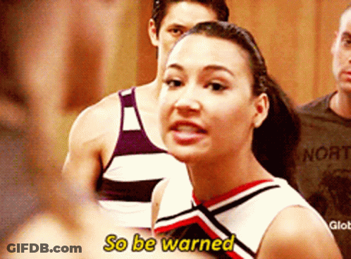 Cheerleader Says So Be Warned In Front Of Man In Norte Shirt GIF