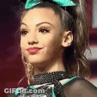 Cheerleader Smiling With Bow GIF