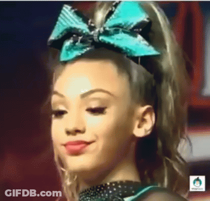 Cheerleader With Blue Bow Smiling GIF
