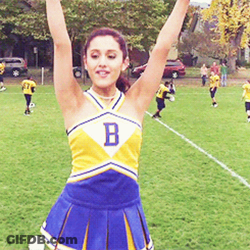 Cheerleader With Letter B Raising Arms GIF