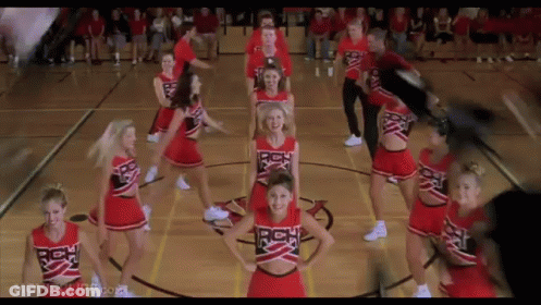 Cheerleaders Dancing In A Circle On Basketball Court GIF