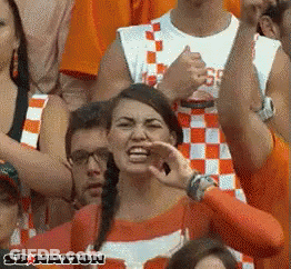 Cheerleaders Dancing In Front Of Mascot In T-Shirt GIF