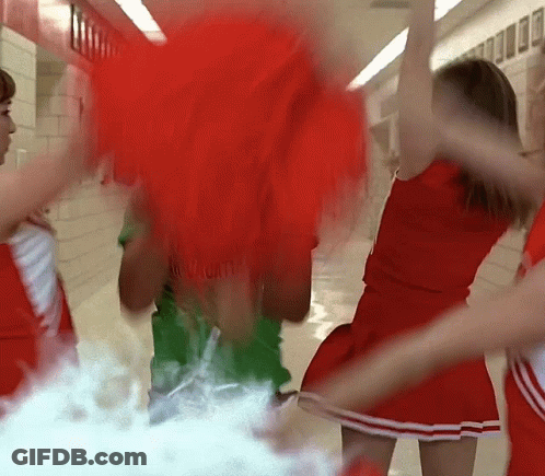 Cheerleaders Dancing In Hallway One Wearing Red GIF