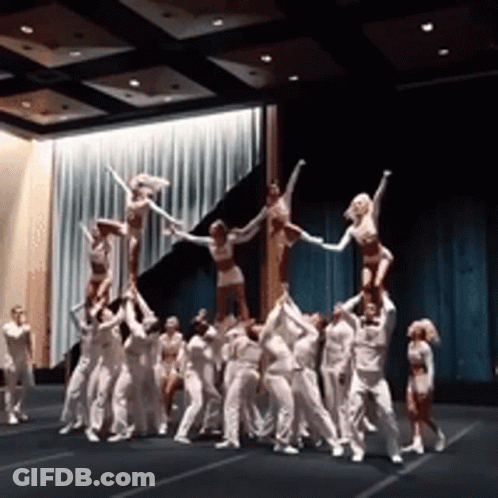 Cheerleaders Doing Pyramid On Stage GIF