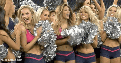 Cheerleaders Holding Pom Poms Laughing GIF