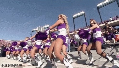 Cheerleaders In Purple And White Uniforms Are Dancing In A Line GIF