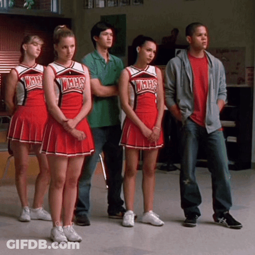 Cheerleaders In WMHS Uniforms Standing In Row GIF