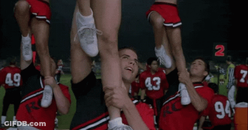 Cheerleaders Lifted By Man In Number 2 Jersey GIF