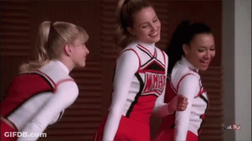 Cheerleaders Standing Next To Each Other GIF