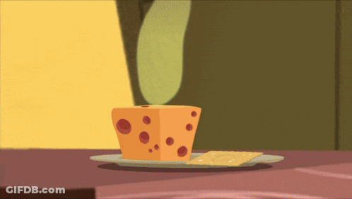 Cheese On A Plate Next To Crackers GIF