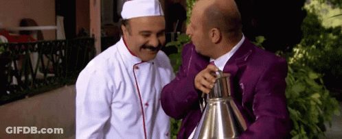 Chef And Man In Purple Suit Talking GIF