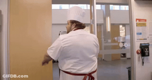 Chef In Hat Standing In Front Of Emergency Procedures Sign GIF