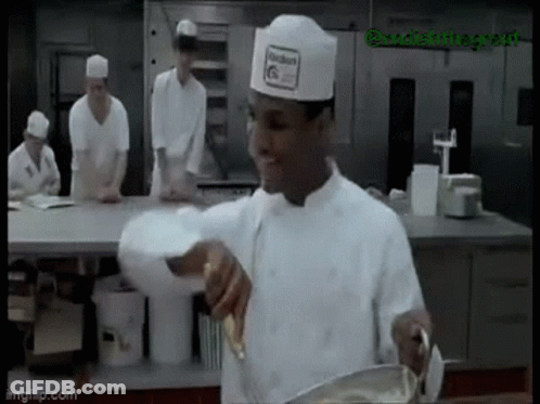 Chef In Hat Stirring In Kitchen GIF