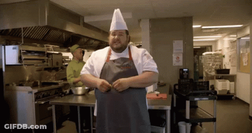 Chef In Kitchen With No Smoking Sign GIF