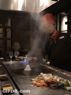 Chef In Red Hat Cooking Vegetables GIF